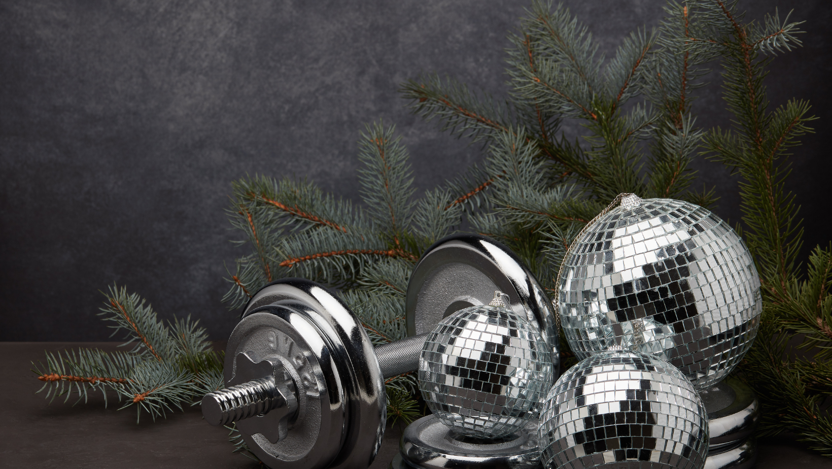 Dumbbells and disco-ball baubles beneath pine branches
